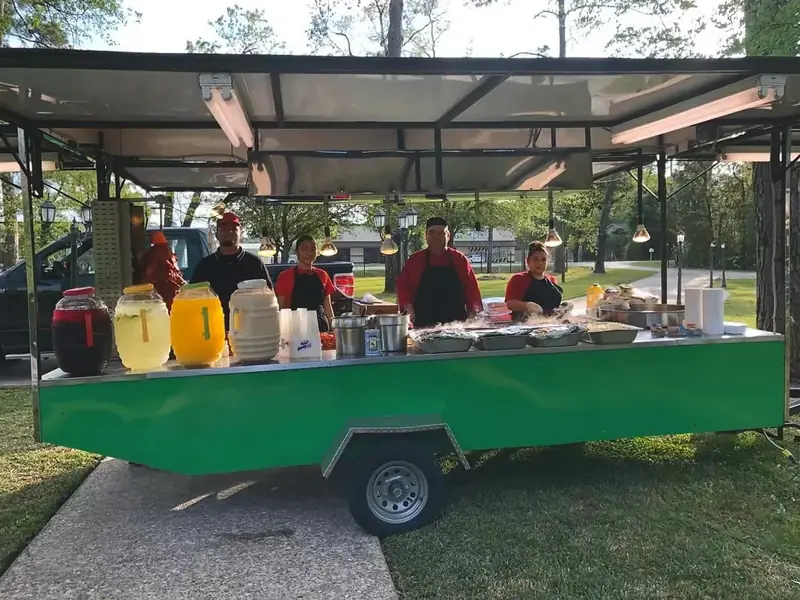 Taqueria 4 Brothers catering trailer serving at an event